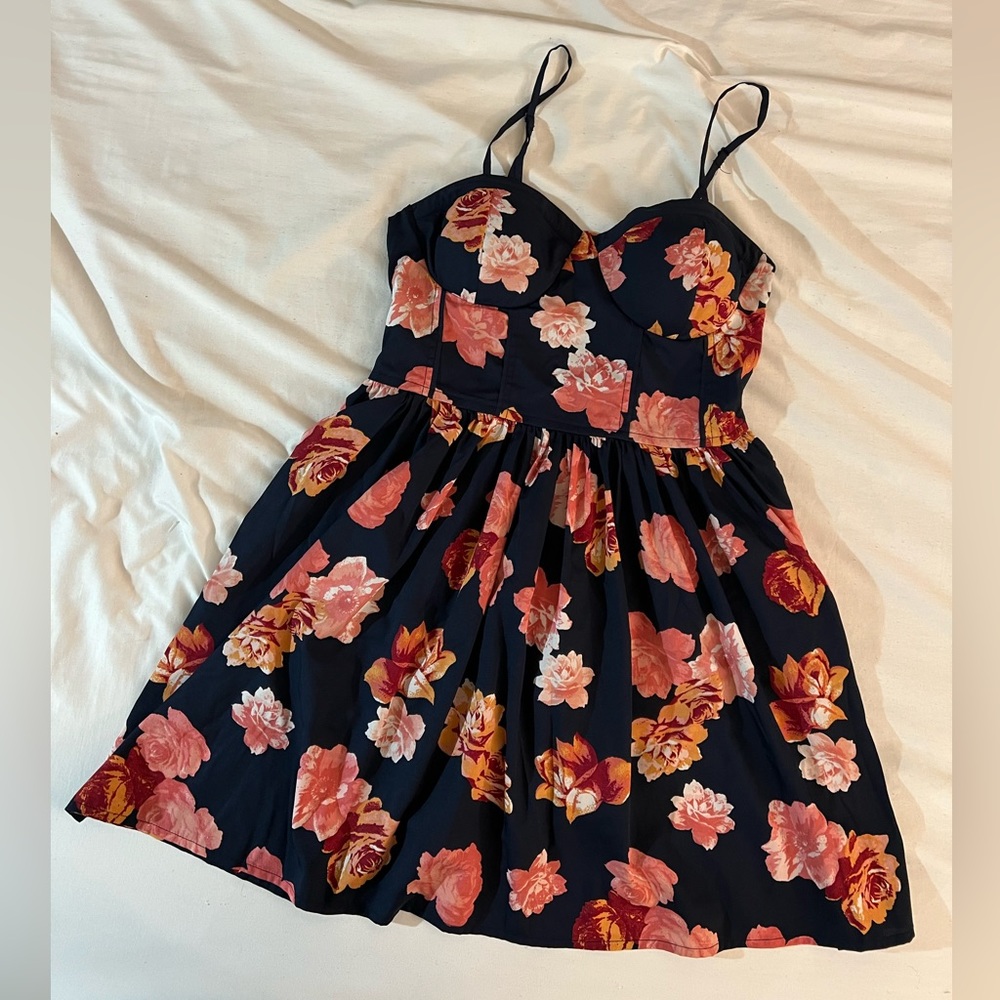 Navy blue cami mini dress with adjustable straps and sweetheart neck. Size Large